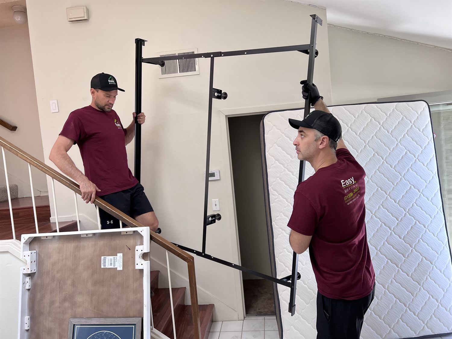 Easy Moving LA crew disassembling a bed frame